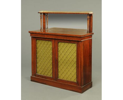 A Regency rosewood chiffonier, with mirrored galleried back, pair of doors with brass grilles and raised on a plinth base.  W