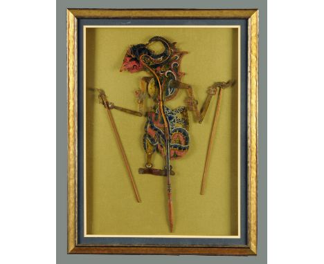 An Indonesian articulated puppet, framed and glazed.  Frame 70 cm x 54 cm.