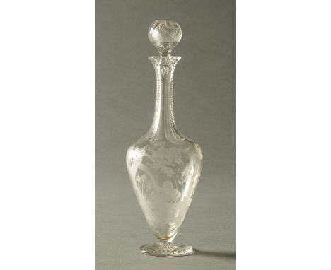 A 19th century cut and engraved glass flask, decorated with a snake, birds and foliage.  Height 27 cm.  CONDITION REPORT: Bot