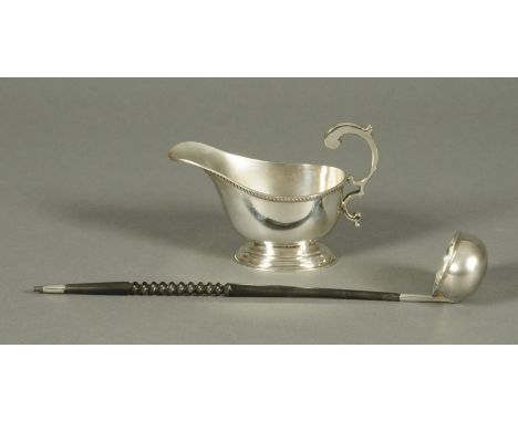 A Mappin & Webb silver sauce boat, Birmingham 1933, 220 grams, and a silver toddy ladle, Birmingham mark modern.