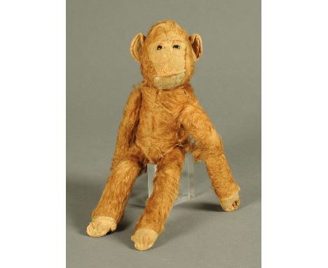 A vintage stuffed toy monkey.  Height 39 cm. 