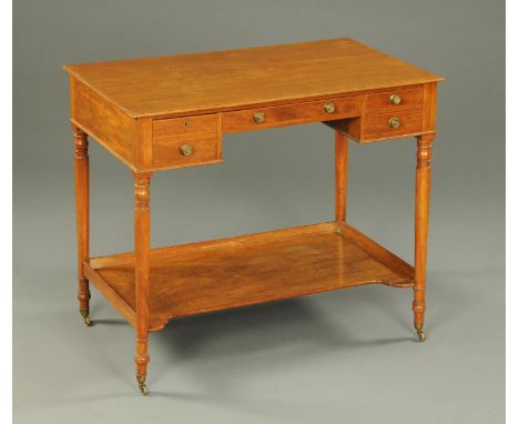 A Regency mahogany washstand, fitted with a series of frieze drawers and raised on turned legs united by a low shelf and with