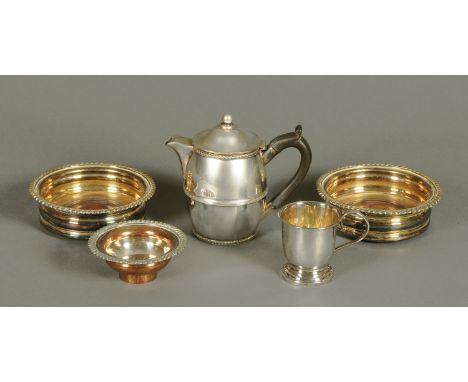 A pair of silver plated decanter coasters, with wooden bases, a part wine funnel, an EPNS christening mug and hot water jug. 