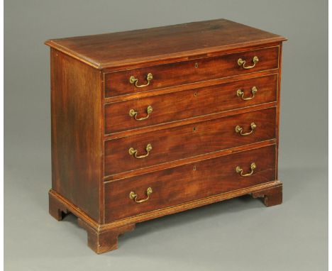 A George III mahogany chest of drawers, with moulded edge above four long graduated drawers with swans neck drop handles and 