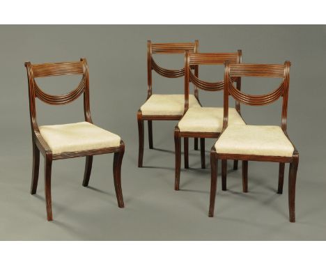 A set of four Regency dining chairs, stamped "Wilkinson, Ludgate Hill", each with reeded bar back, swags, conforming Wellingt