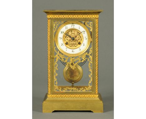 An Edwardian four glass and brass mantle clock, with two-train striking movement.  Height 31 cm, width 18 cm (see illustratio