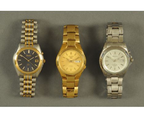 A vintage Seiko day/date wristwatch, and two Seiko Kinetic gentleman's wristwatches.  