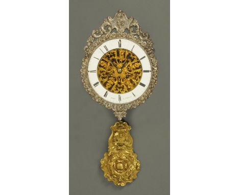 A French two-train clock movement, with pendulum and enamelled chapter ring.  Diameter 16 cm.