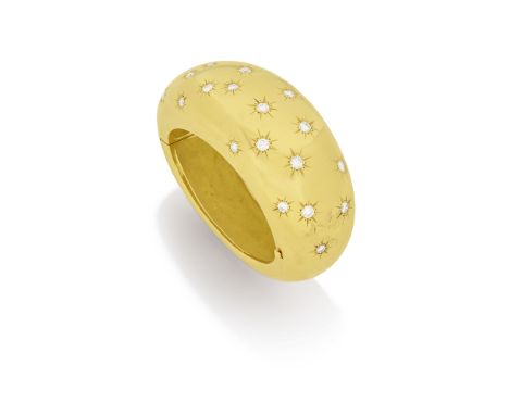 DIAMOND-SET BANGLE, CIRCA 1950The hinged, polished cuff, star-set with brilliant-cut diamonds,  diamonds approximately 5.05 c