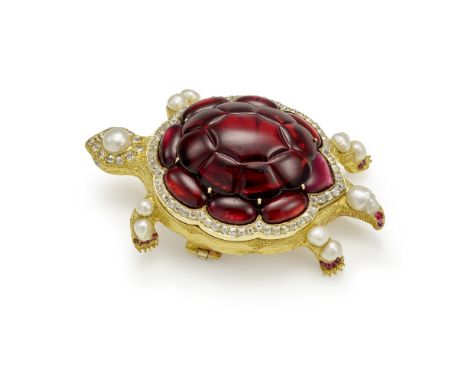 GARNET AND GEM-SET TURTLE BROOCH, CIRCA 1860The central garnet cabochon carved to resemble a shell,  within a surround of var