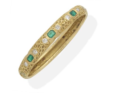 ATTRIBUTED TO TIFFANY: ART NOUVEAU EMERALD AND DIAMOND BANGLE, CIRCA 1884Chased throughout with cloud motifs, and green ename
