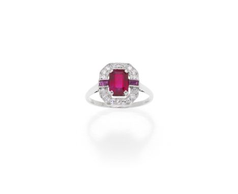 RUBY AND DIAMOND RING, MID 20TH CENTURYThe step-cut ruby within a surround of single-cut diamonds, accented by step-cut ruby 