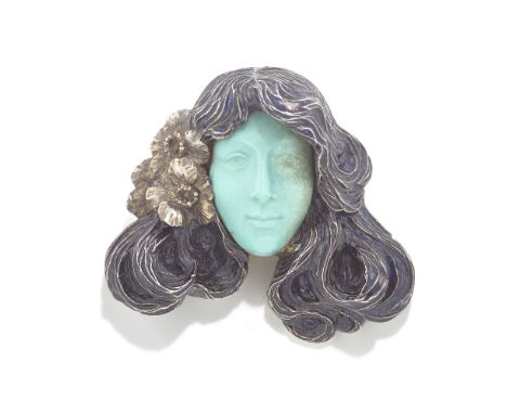 RENÉ LALIQUE: ART NOUVEAU TURQUOISE, ENAMEL AND SILVER BROOCH, CIRCA 1900Designed as the head of a female, her face of carved