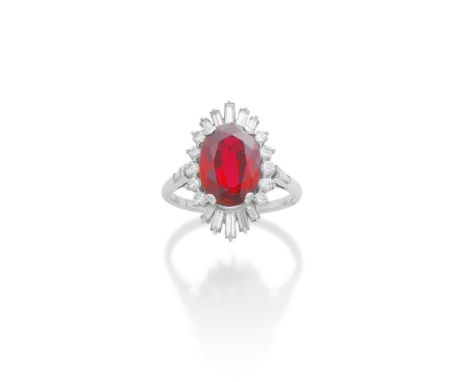 RUBY AND DIAMOND RINGThe oval-cut ruby, weighing 5.93 carats, within a border of brilliant and baguette-cut diamonds, ring si