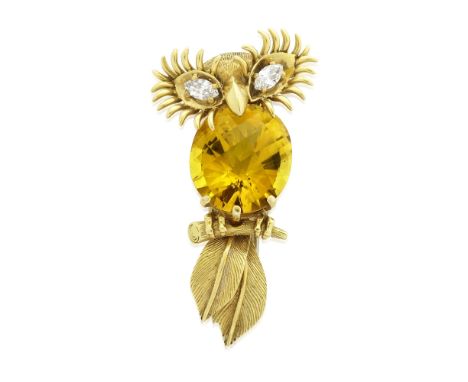 MONTURE CARTIER: CITRINE AND DIAMOND OWL BROOCH, CIRCA 1960Perched on a textured branch, with a oval checkerboard-cut citrine