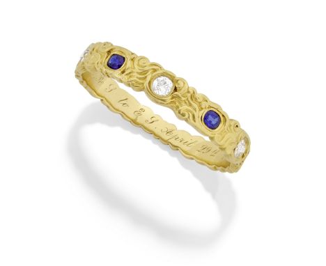 TIFFANY: ART NOUVEAU GOLD, SAPPHIRE AND DIAMOND HINGED BANGLE, CIRCA 1886Chased throughout with meandering scroll motifs, the