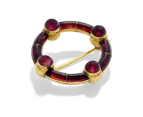 GOLD AND GARNET BROOCH, CIRCA 1860Of Saxon inspiration, the annular form set with garnet carbuncles, accented by four garnet 