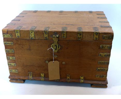 A 20th century Indian teak trunk with brass fittings, H.34 W.58 D.38cm 