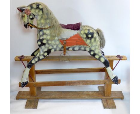 A vintage hand painted and carved wooden rocking horse, H.119 W.131 D.47cm 