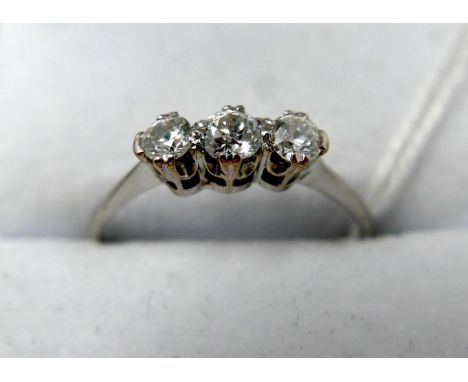 A white metal ring set with three diamonds, in box, 2 grams 