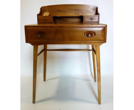 A mid 20th century Ercol elm desk, H.95 W.68 D.46cm 