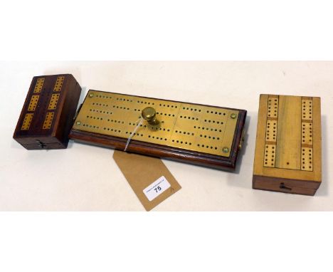 Three wooden cribbage boards to include two hinged examples and a long brass-bound example on brass bun feet 