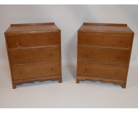 A pair of early 20th century light oak side chests of three drawers, H.72 W.61 D.42cm 