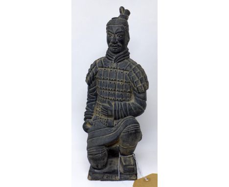 A Chinese terracotta statue of a warrior, H.30cm 