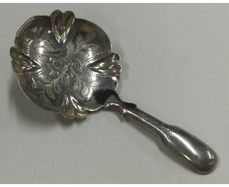 A good George III bright cut silver caddy spoon. Birmingham 1811. By Cocks & Bettridge. Approx. 8 grams. Est. £50 - £80.