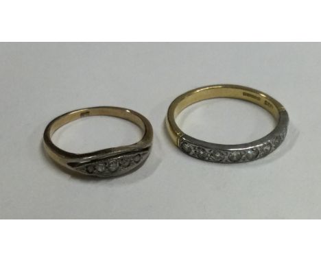 A good diamond half eternity ring in 18 carat gold setting together with one other. Approx. 4 grams. Est. £100 - £150.