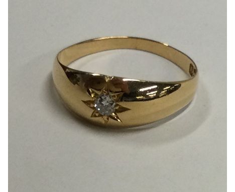 A good diamond single stone gypsy set ring in 18 carat gold mount. Approx. 3.3 grams. Est. £200 - £250.