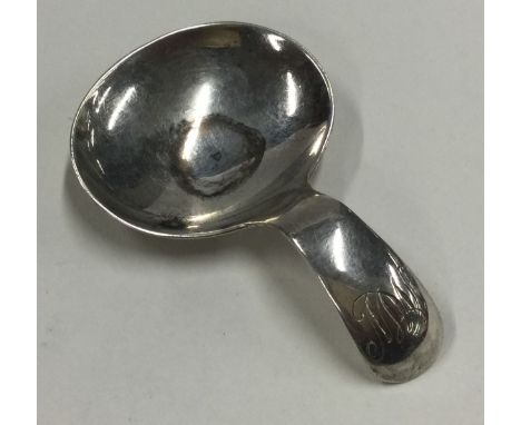 A Georgian style silver caddy spoon. London 1969. By R&K. Approx. 11 grams. Est. £30 - £60.