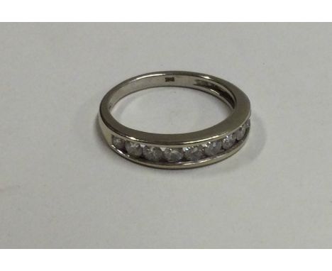 A good 18 carat gold diamond half eternity ring. Approx. 2.2 grams. Est. £200 - £300.