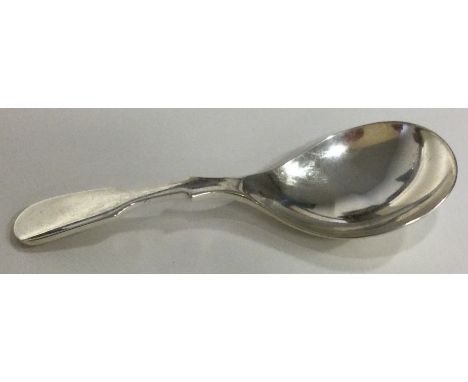A modernistic silver caddy spoon. Approx. 20 grams. Est. £30 - £50.