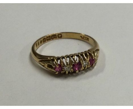 An Antique ruby and diamond seven stone ring. Approx. 3.4 grams. Est. £200 - £250.