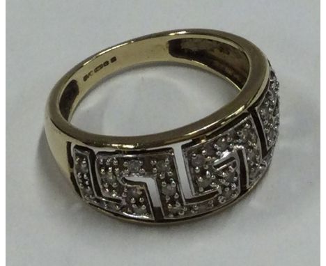 A 9 carat diamond mounted ring. Approx. 3.4 grams. Est. £30 - £50.