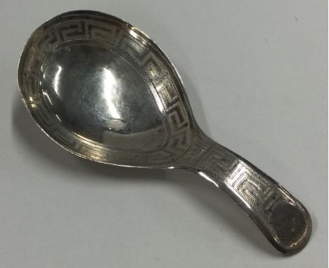 A George III silver caddy spoon with bright cut decoration. Birmingham 1814. By John Taylor. Approx. 9 grams. Est. £50 - £80.