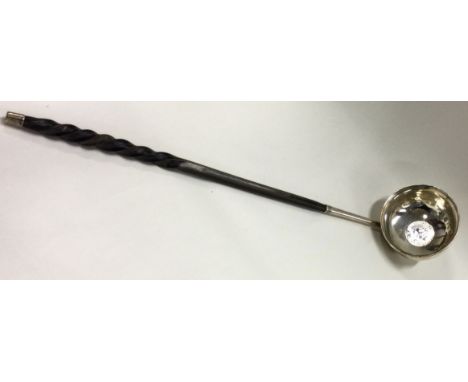 A heavy Georgian silver toddy ladle with whalebone handle. Approx. 47 grams. Est. £30 - £50.