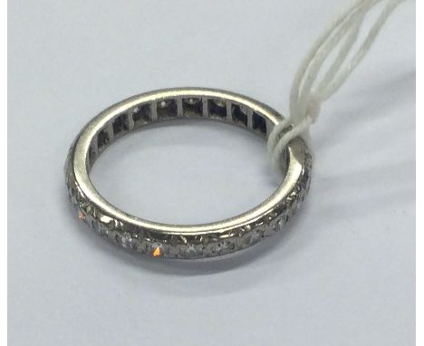 A good diamond full eternity ring set in white gold. Approx. 3.7 grams. Est. £100 - £150.