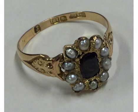 A good ruby and pearl Antique cluster ring in 18 carat gold mount. Approx. 2.6 grams. Est. £180 - £220.