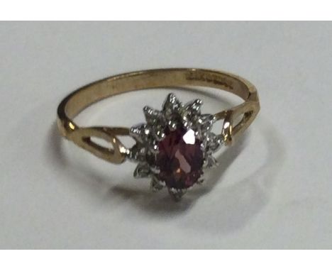 An attractive diamond set cluster ring in two colour gold mount. Approx. 1.7 grams. Est. £60 - £80.