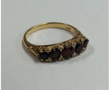 A good Victorian garnet five stone half hoop ring set in 18 carat gold. Approx. 3.8 grams. Est. £250 - £300.