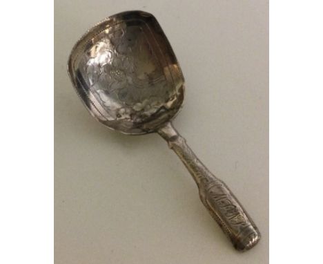 A George III silver caddy spoon with bright cut decoration. Birmingham 1797. By John Taylor. Approx. 9 grams. Est. £20 - £30.