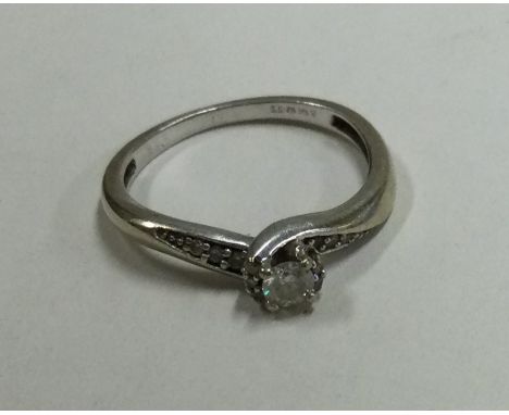 A small diamond single stone ring in 9 carat mount. Approx. 2 grams. Est. £40 - £60.