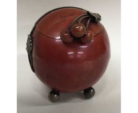 A stylish silver mounted and enamelled inkwell in the form of a fruit with berry finial to hinged lid. Approx. 158 grams. Gro