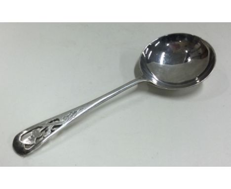 A good large pierced thistle shaped silver caddy spoon. Approx. 17 grams. Est. £30 - £50.