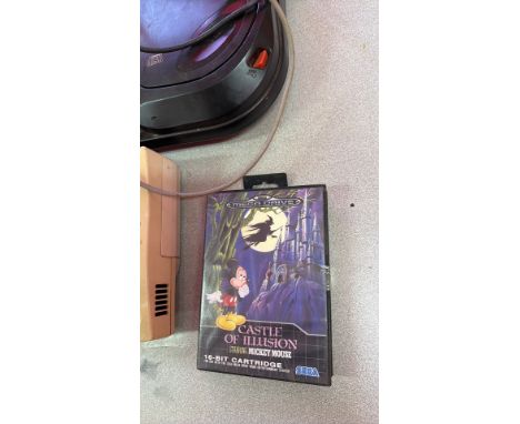 Sega Mega Drive console with Mega-CD, controller, Sonic the Hedgehog cartridge, Castle of Illusion cartridge, and Lethal Enfo