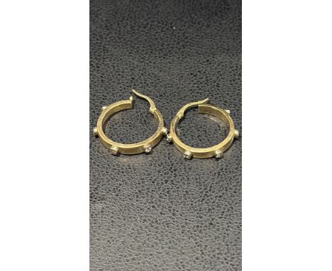 Pair 9ct gold hoop earrings set with white stones. each earring set with 5 stones. Total weight 3,5 grams