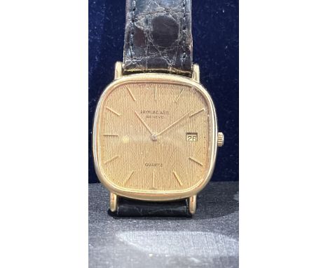 Raymond Weil Genève quartz watch, 18K gold electroplated case, black leather strap, date window at 3 o'clock.