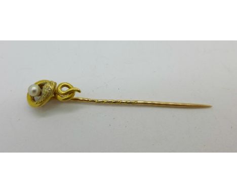 A yellow metal, pearl set snake stick pin, 1.8g